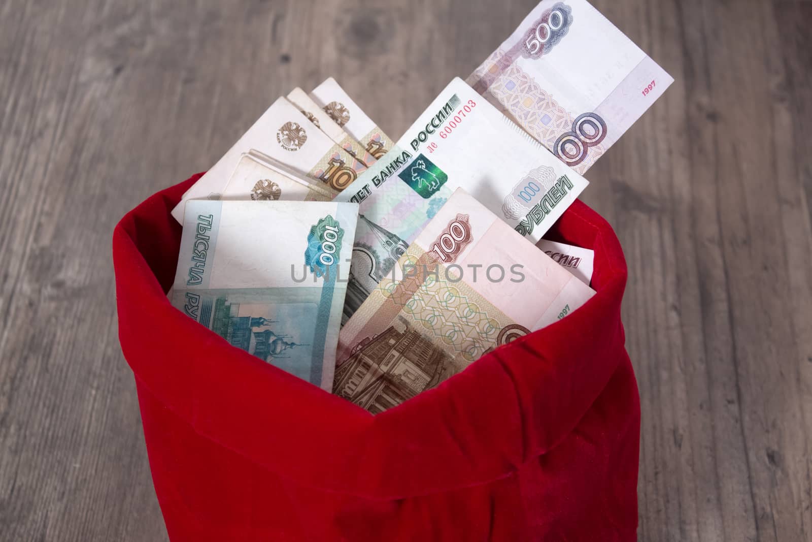 Full bag of money.  Russian rubles in a red bag. Banknote, currency, Bank, business, economy, investment. Salary, winnings, prize, stash