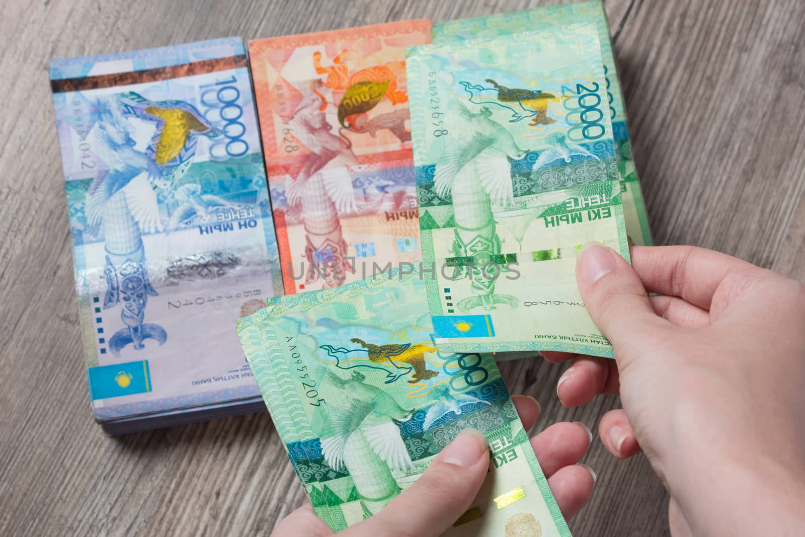 Hands hold a lot of money. Tenge KZT. National currency of Kazakhstan, KZ. Exchange rate. Economy, development, business, Bank, broker. Banknote	
