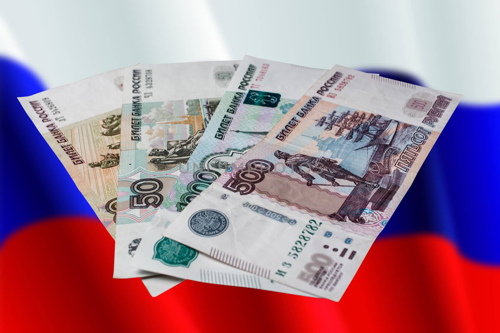 Russian rubles on a colored background. Banknotes of Russian mon by YevgeniySam