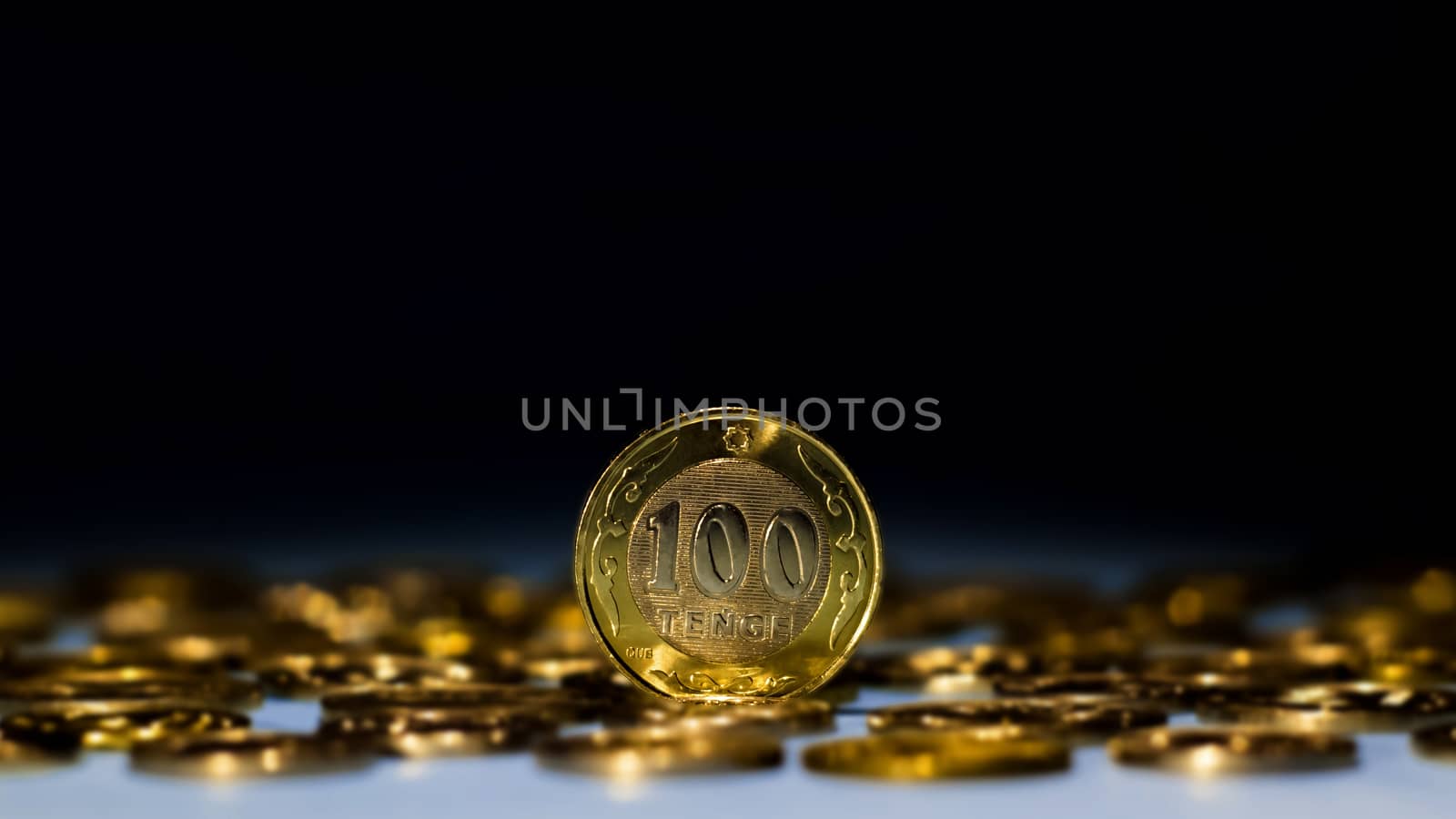 Tenge on a blue background with coins. Tenge coins of Kazakhstan by YevgeniySam