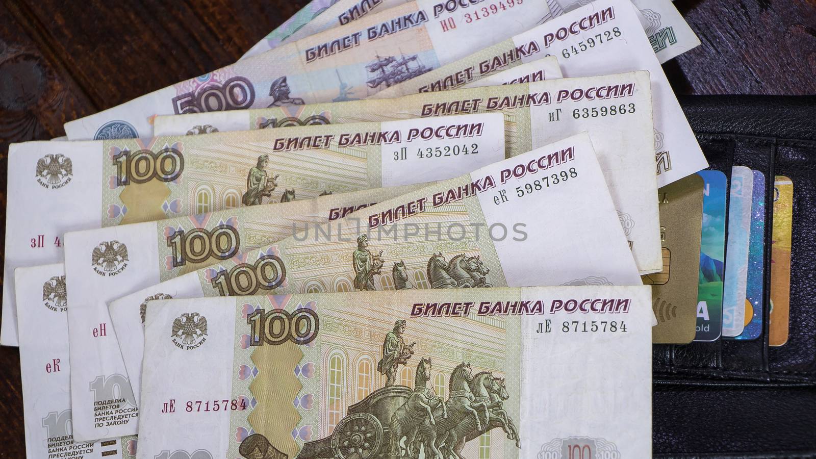 Lot with Russian rubles is on the wallet with credit cards.Paper by YevgeniySam