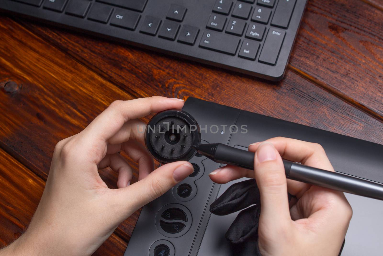 Change the pen tip of the graphics tablet. Draw on a digital tablet. Freelance, designer, Illustrator. Technology, remote work, outsourcing. Glove and pen for a graphic tablet. Project, Close up