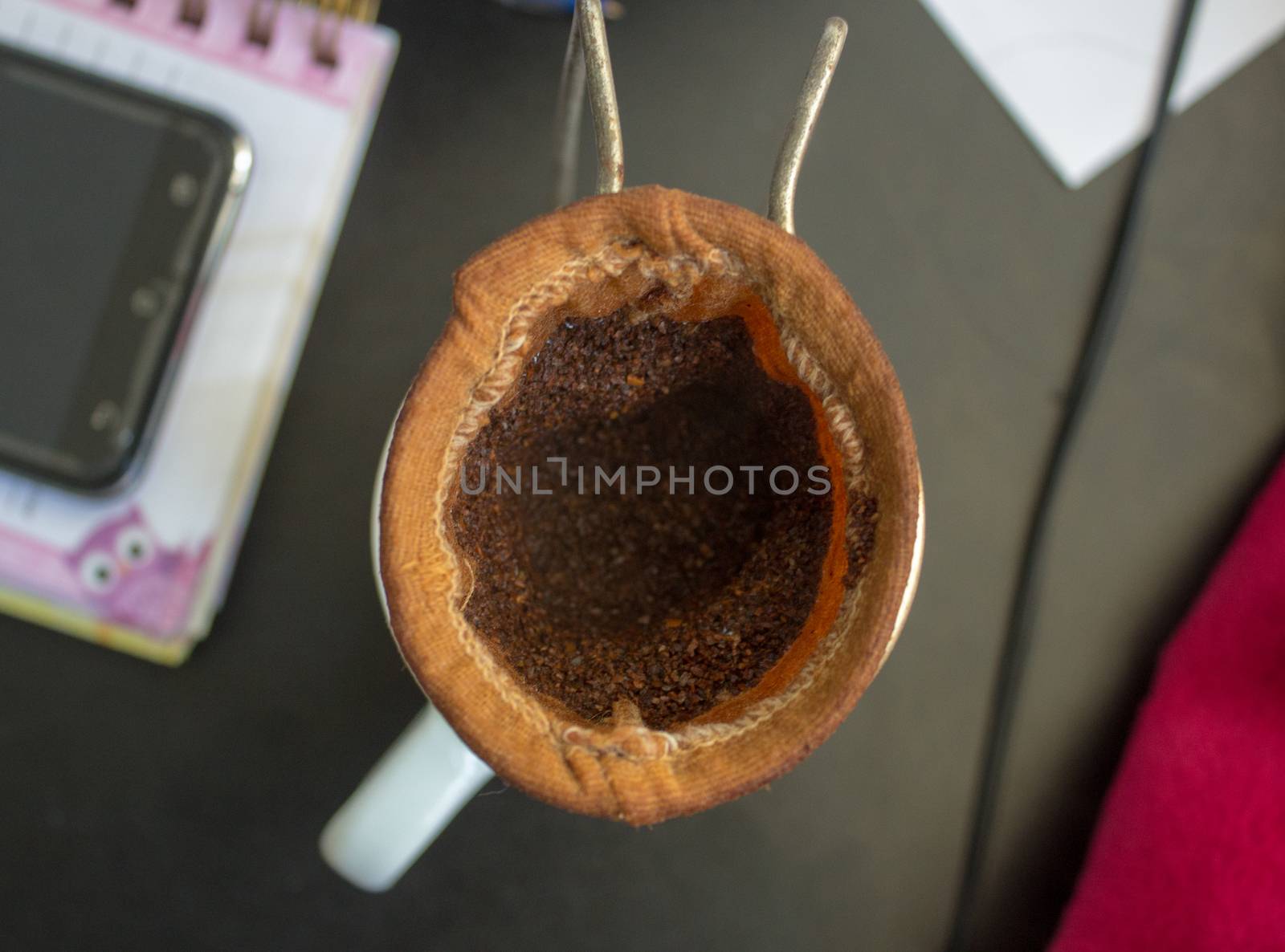 Coffee strainer made of cloth after being used, with the wasted powder