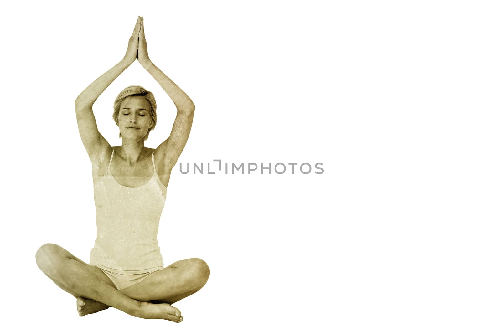 Fit woman doing yoga against yellow leaf