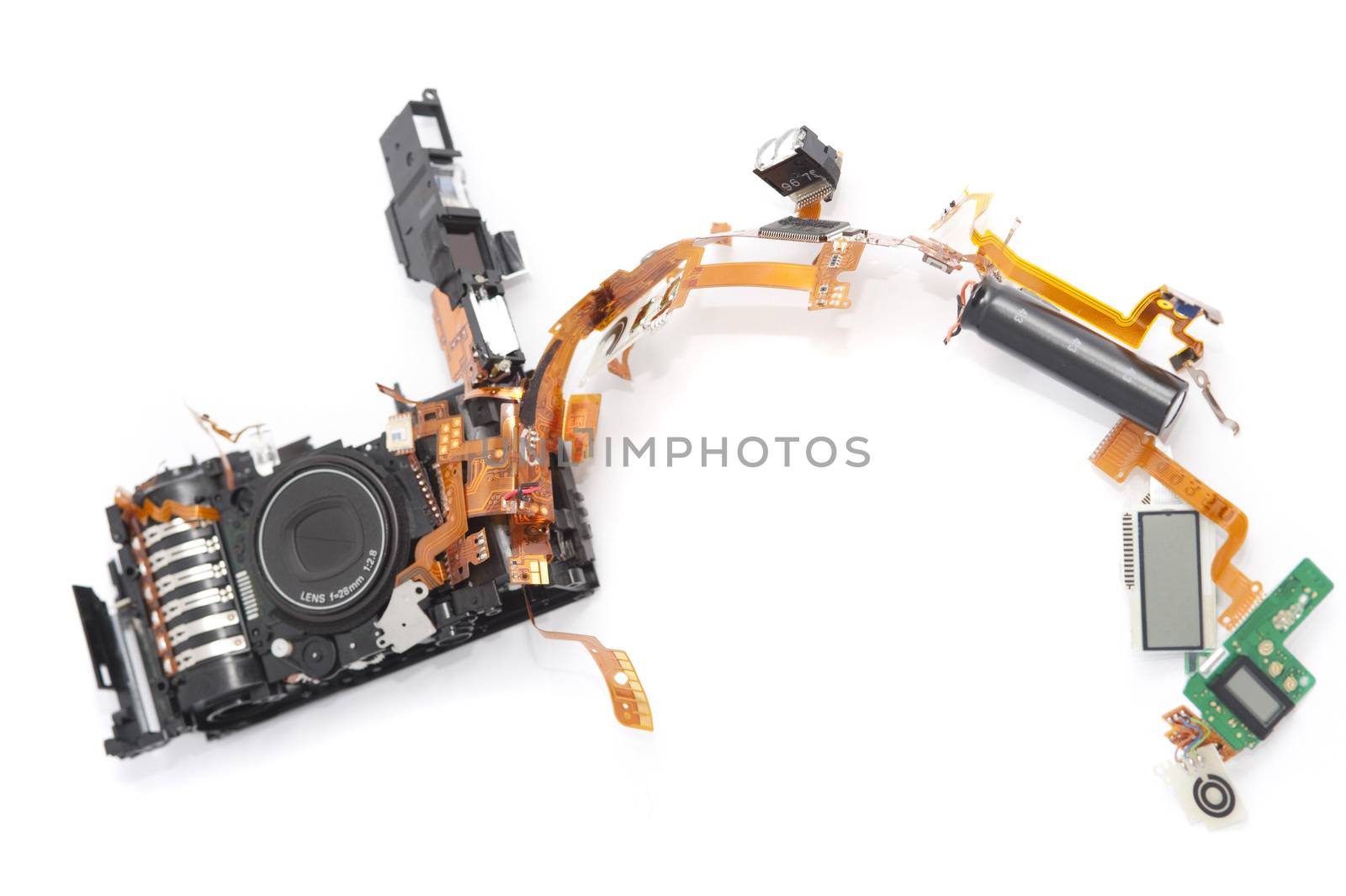 Dismantled camera lying in parts on white by stockarch