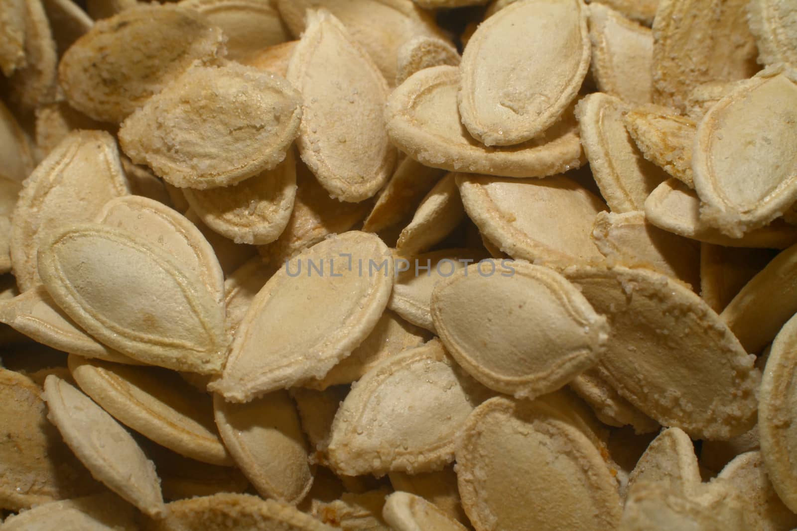 Pumpkin Seeds roasted in market, macro close up
