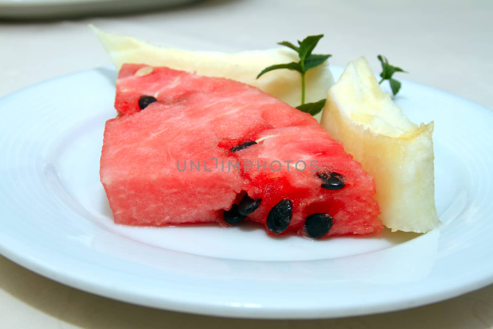 melon and watermelon in serving plate in restaurant