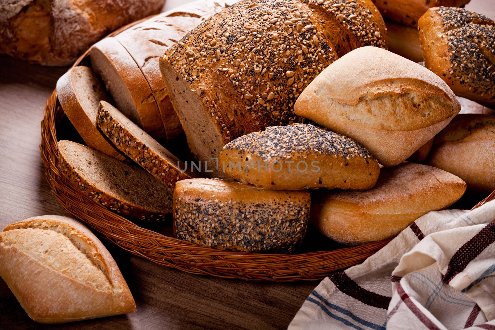 Display Of A Variety Of Breads In A Basket by mpessaris