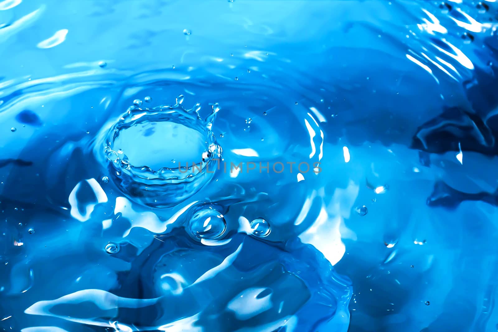 Water splash close-up. Drop of water. Blue water drop. Falling b by YevgeniySam