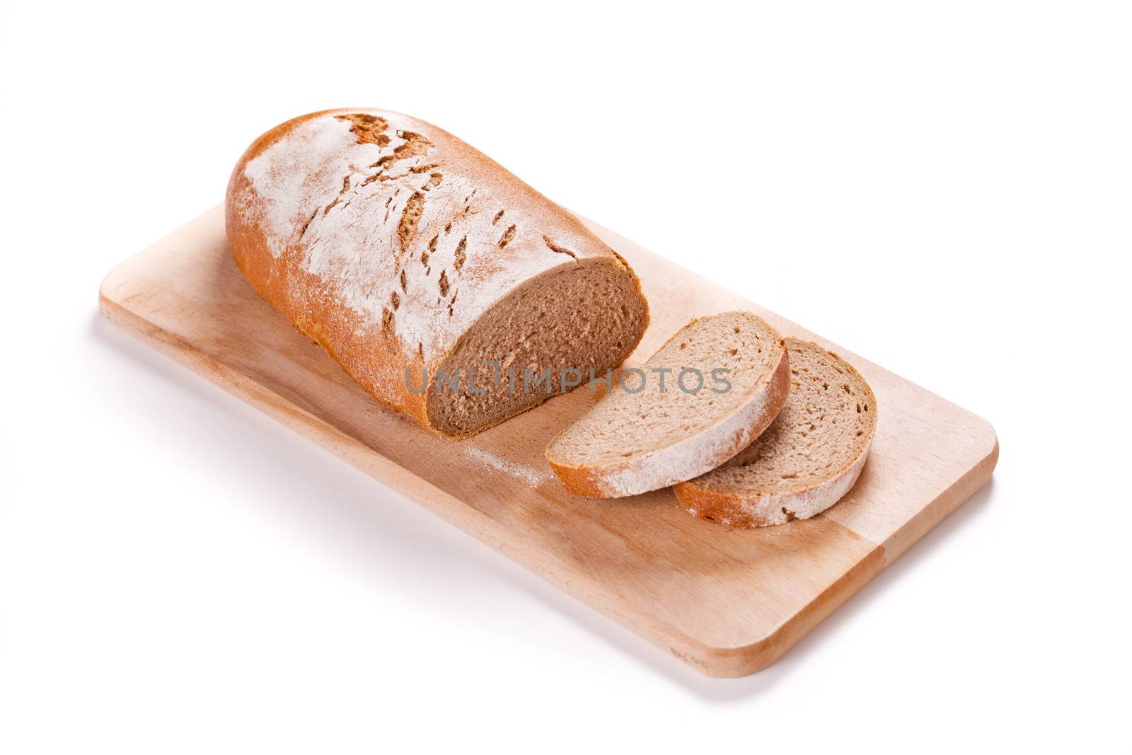 Loaf Of Bread On A Cutting Board by mpessaris