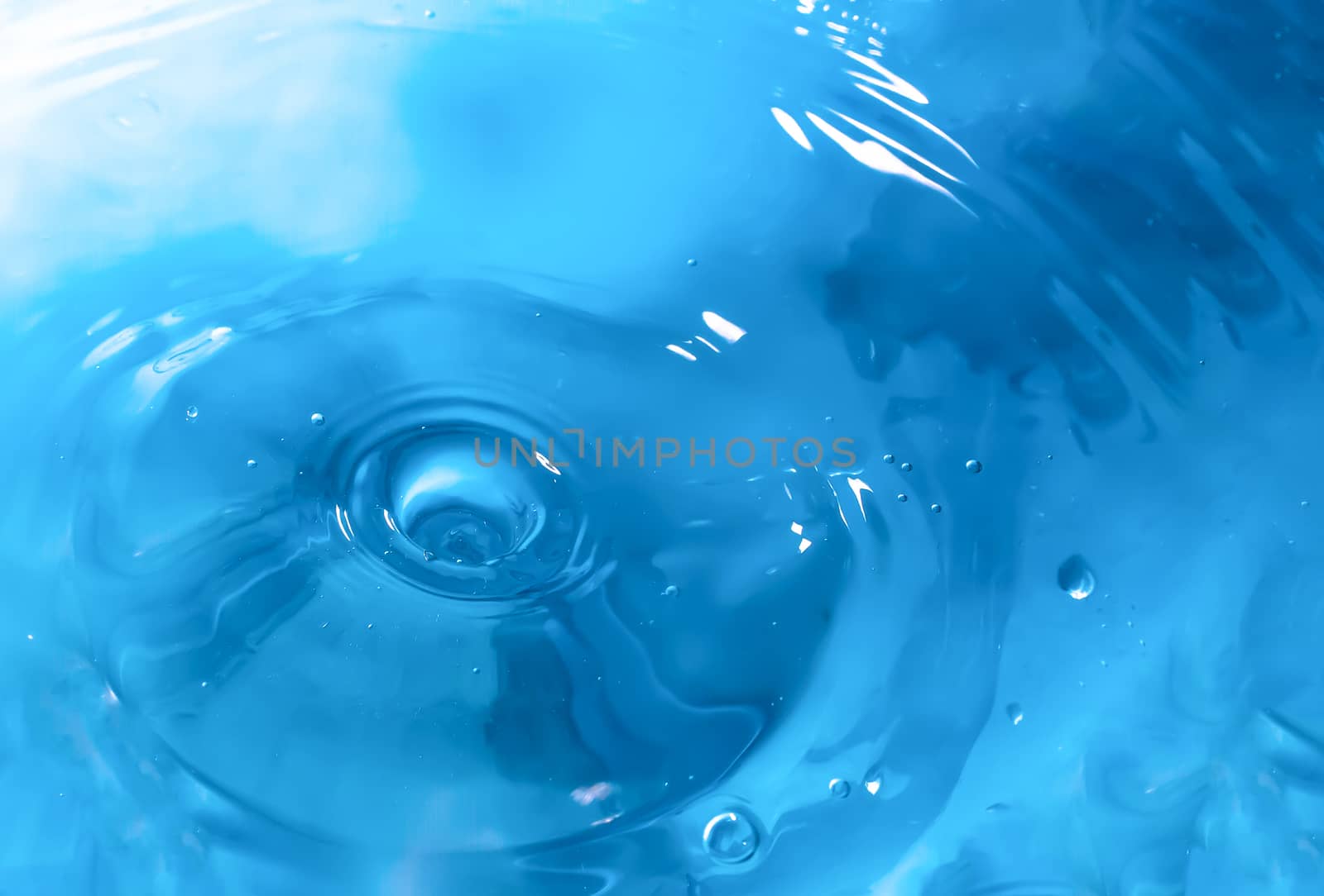 Water splash close-up. Drop of water. Blue water drop. Falling b by YevgeniySam