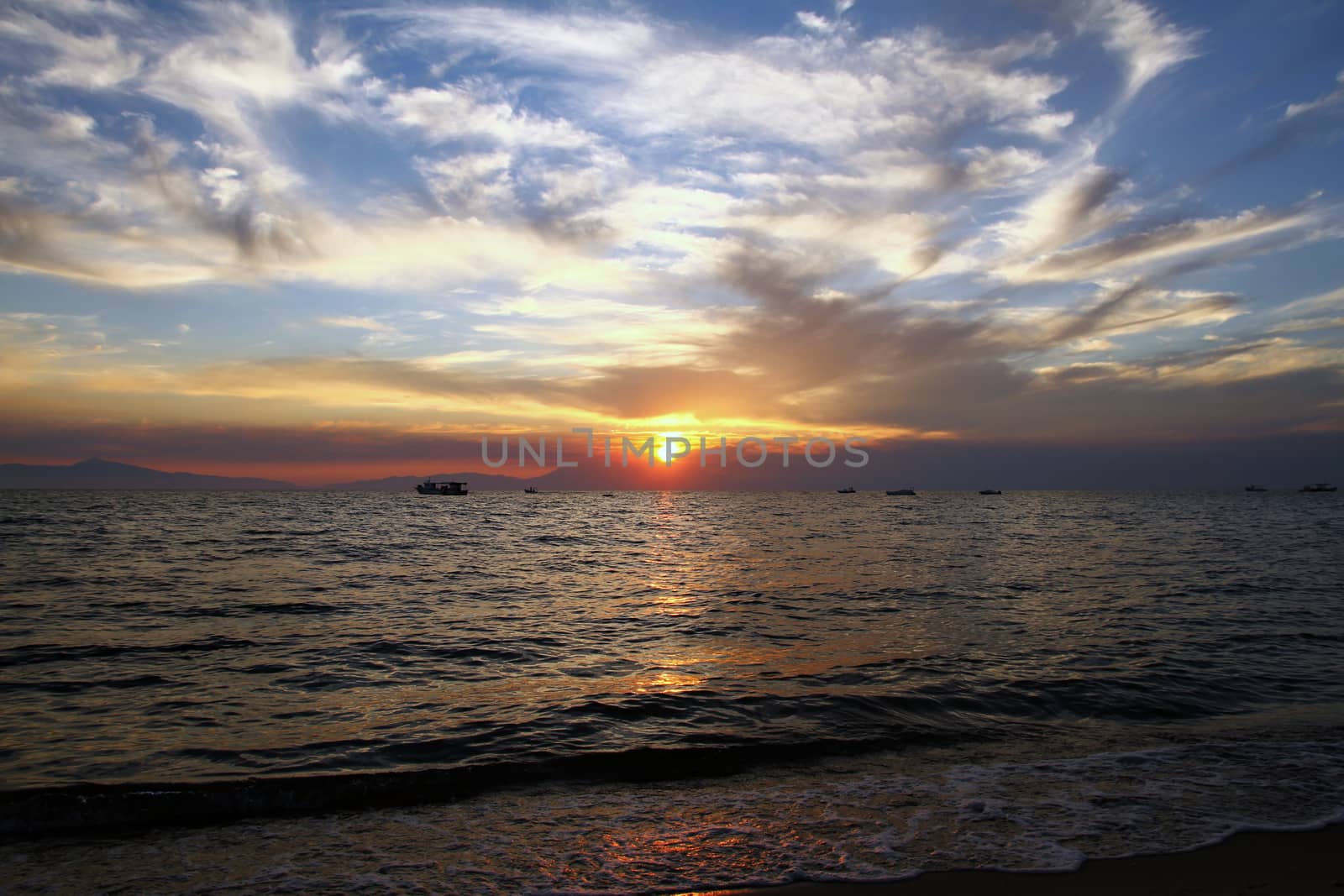 Red purple orange sunset over sea, beautiful cloud space