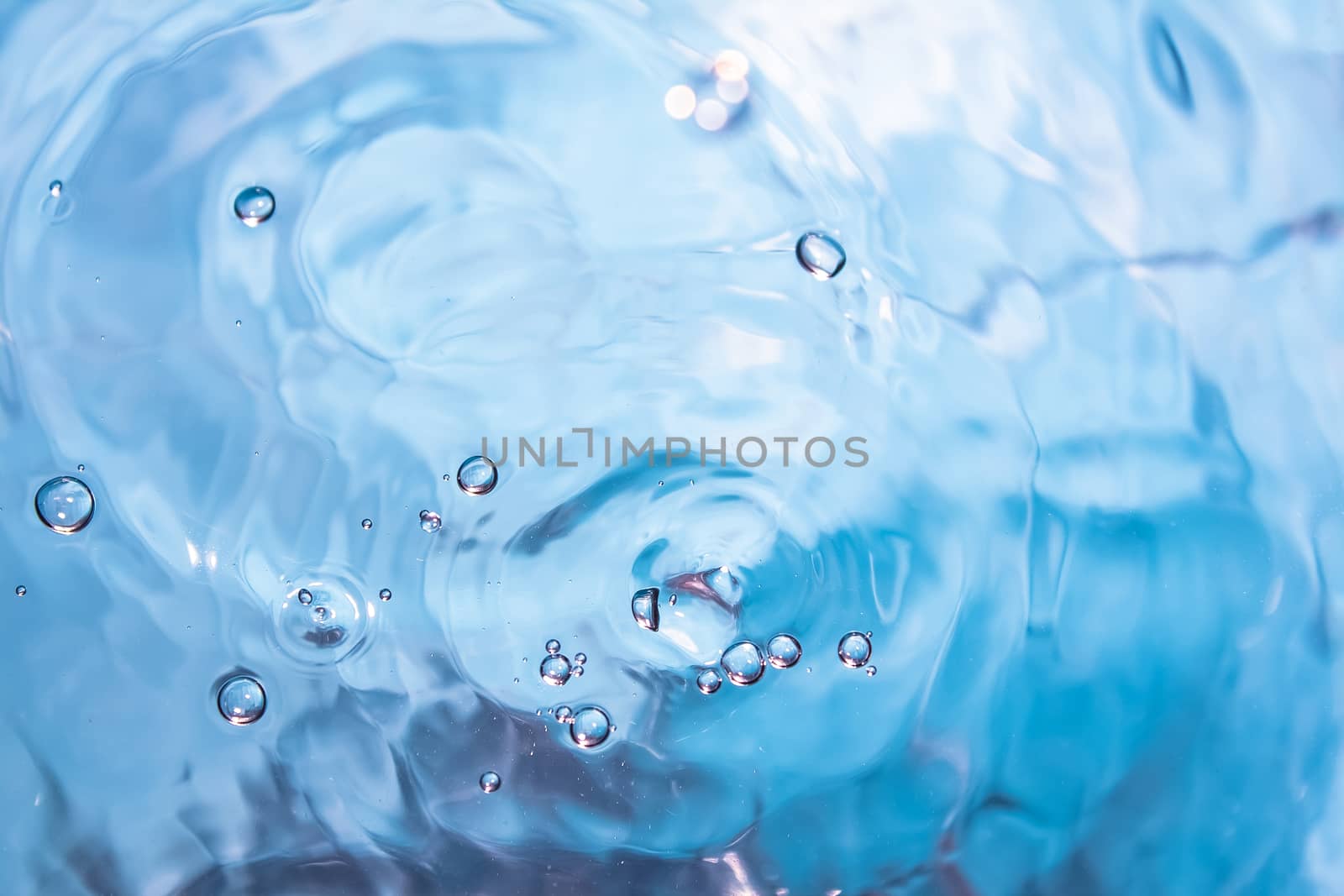 Water splash close-up. Crown of blue water. Water drop by YevgeniySam