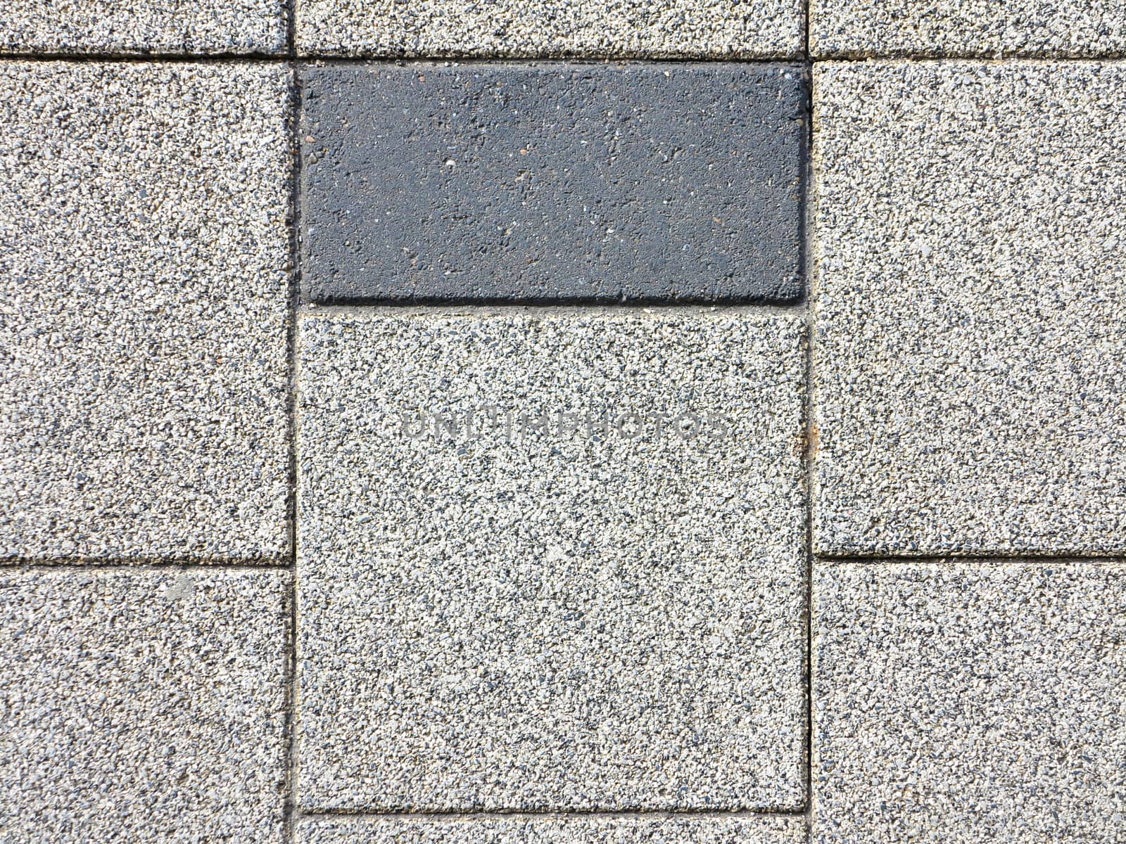 Seemingly pattern of grey color concrete road pavement brick of the pedestrian pathway