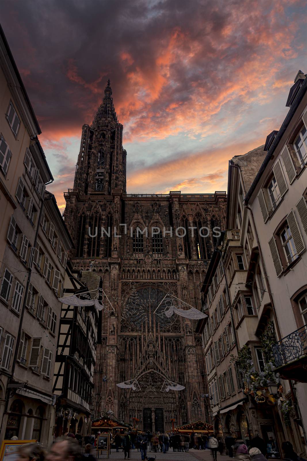 Sunset on the Strasbourg cathedral during the festive and happening Christmas season by ankorlight