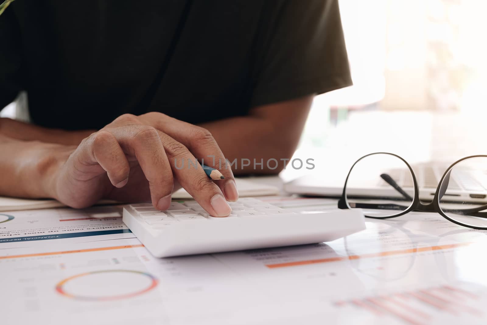 Accountant using a calculator to calculate the numbers. Accounting , Accountancy from financial report and calling to consultant, Calculation Concept.