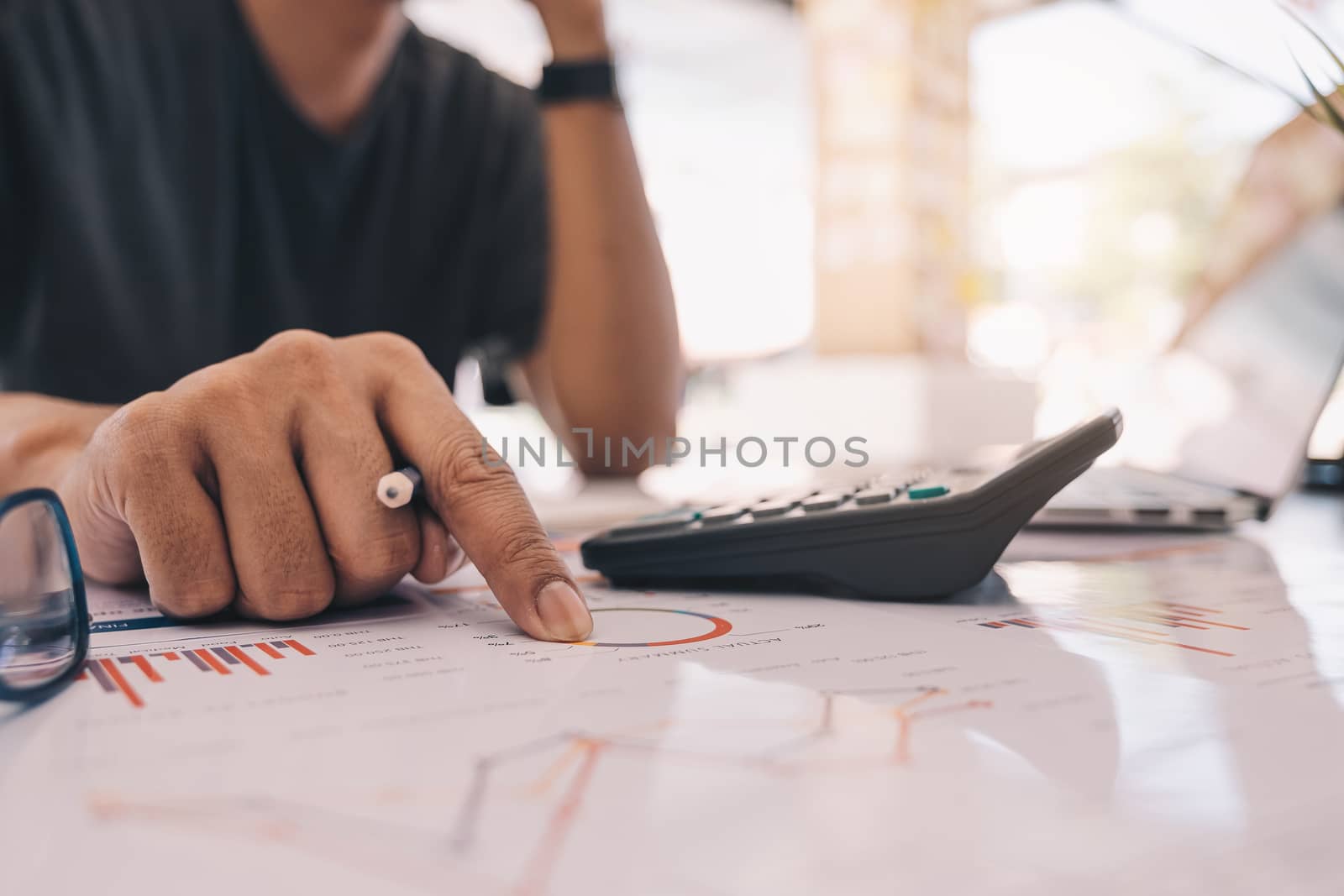 Accountant using a calculator to calculate the numbers. Accounting , Accountancy from financial report and calling to consultant, Calculation Concept.