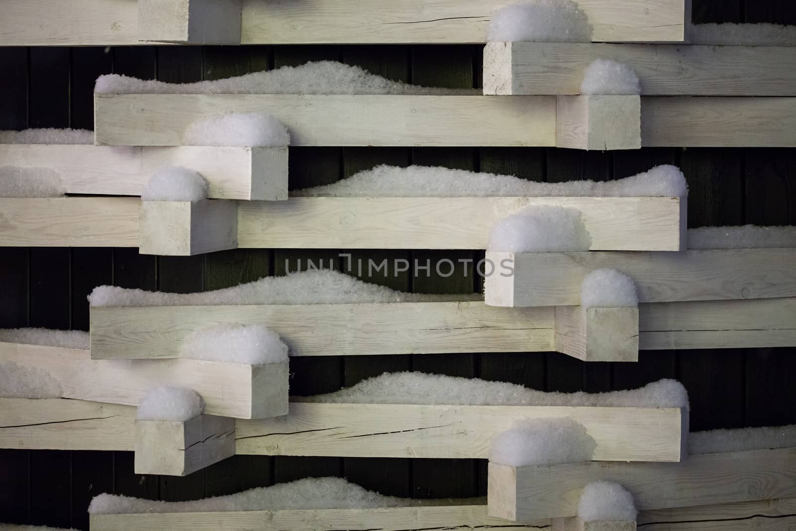 white wooden blocks with snow bstract winter background.