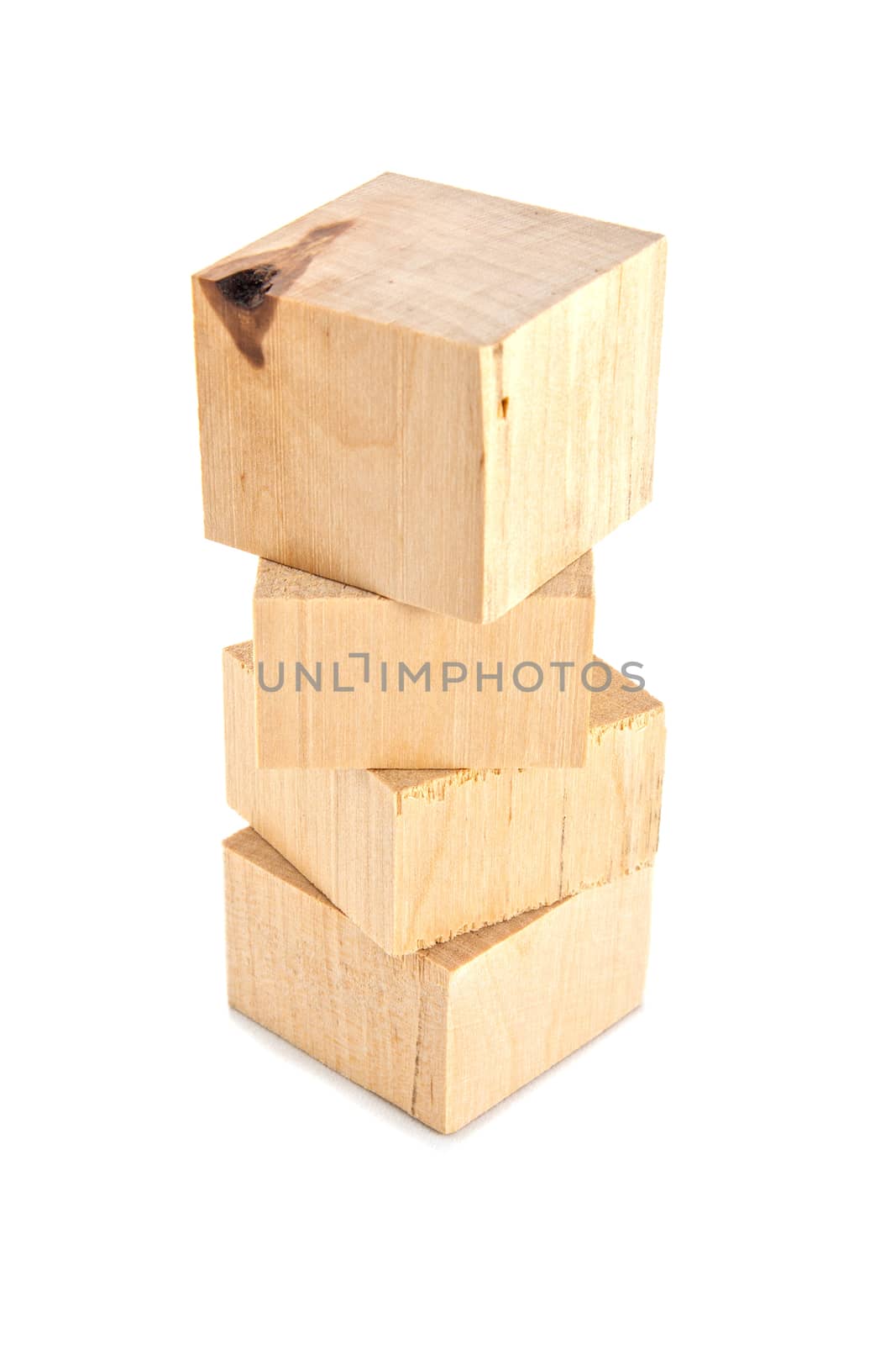 vertical stack of wooden bricks or leftoovers isolated on white background