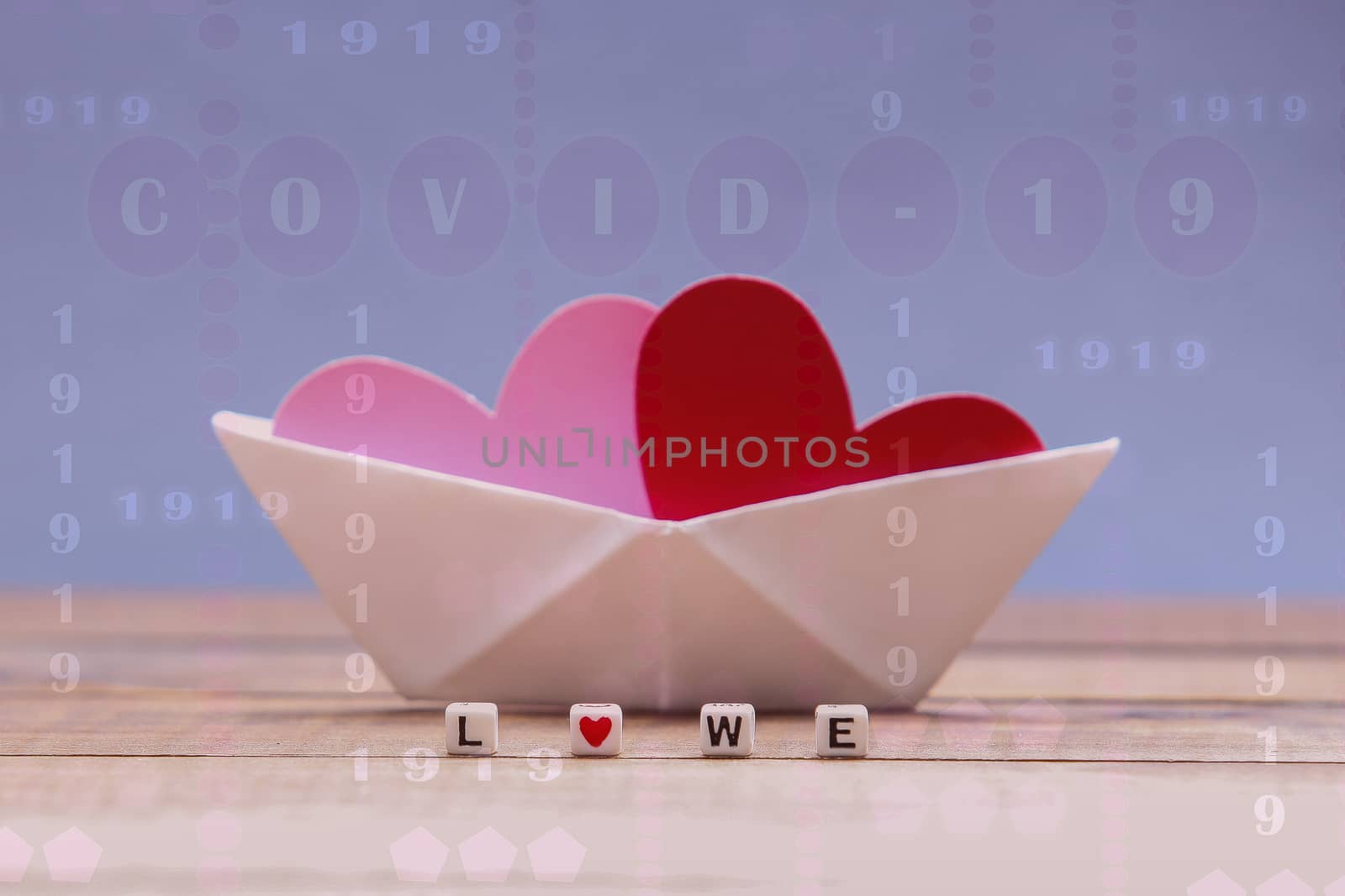 Covid-19 virus digital illustratin with paper boats and hearts photo