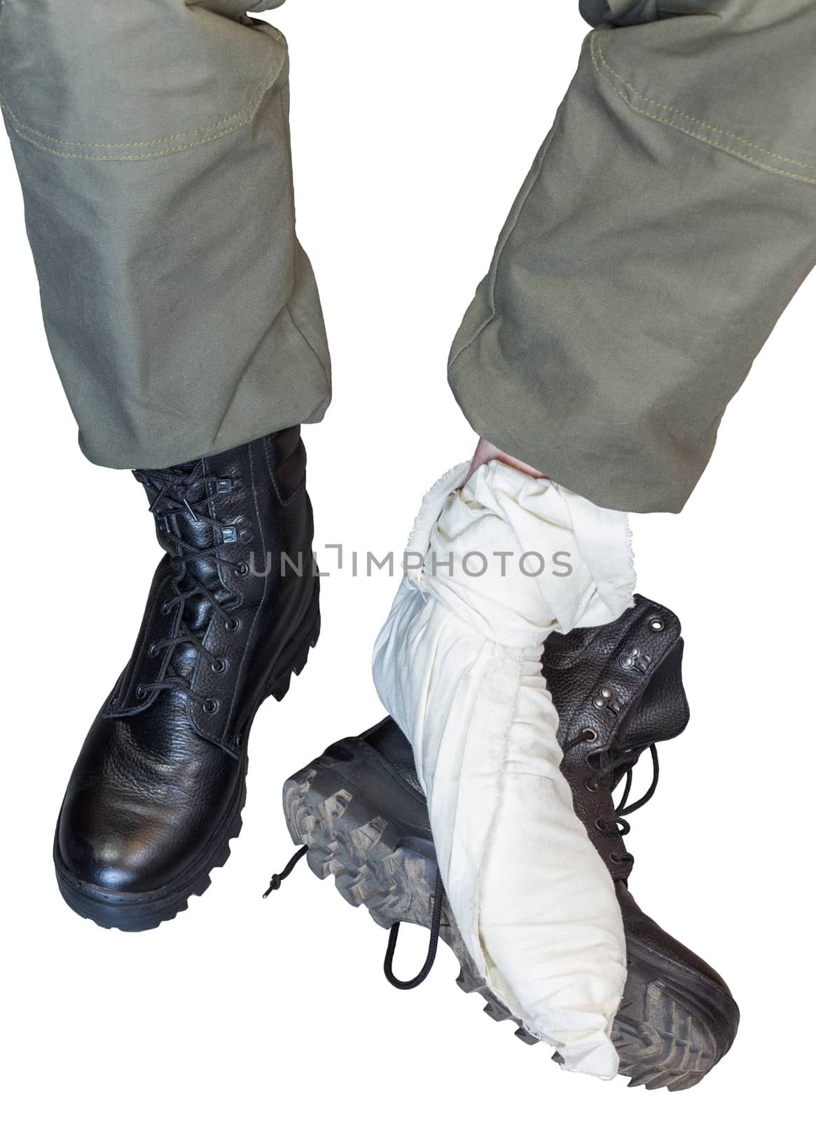 two legs wearing footcloths with military high burts boots isolated on white background
