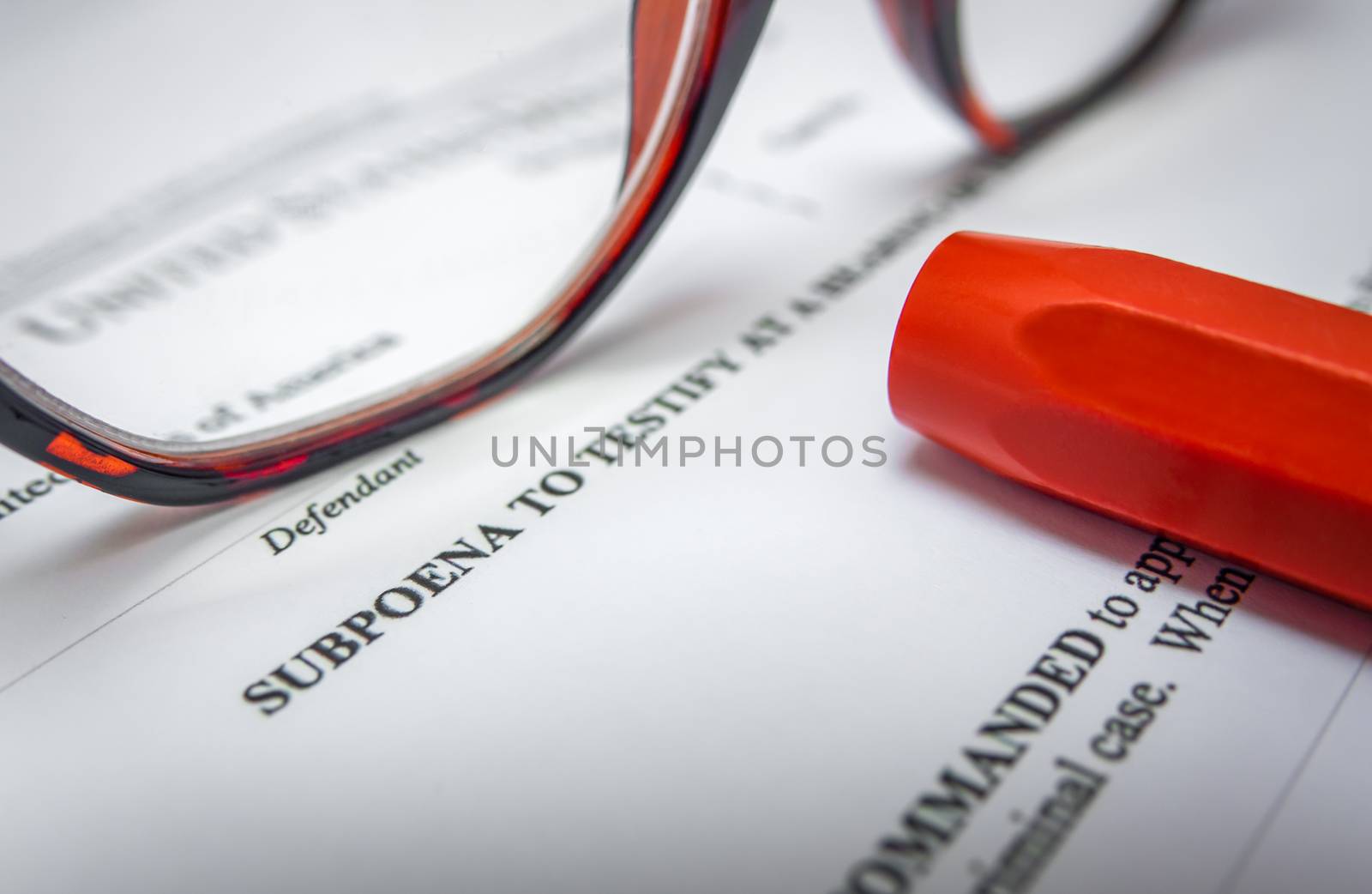 Detail Of A Subpoena For A Criminal Court Case With Glasses And A Pen