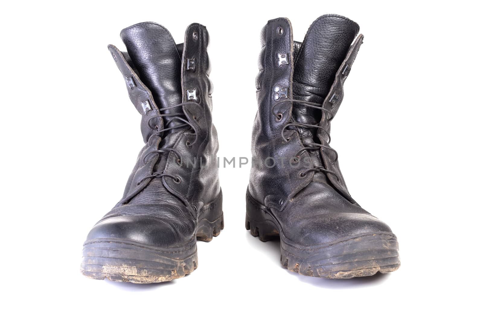 used dirty and dusty military black boots isolated on white back by z1b