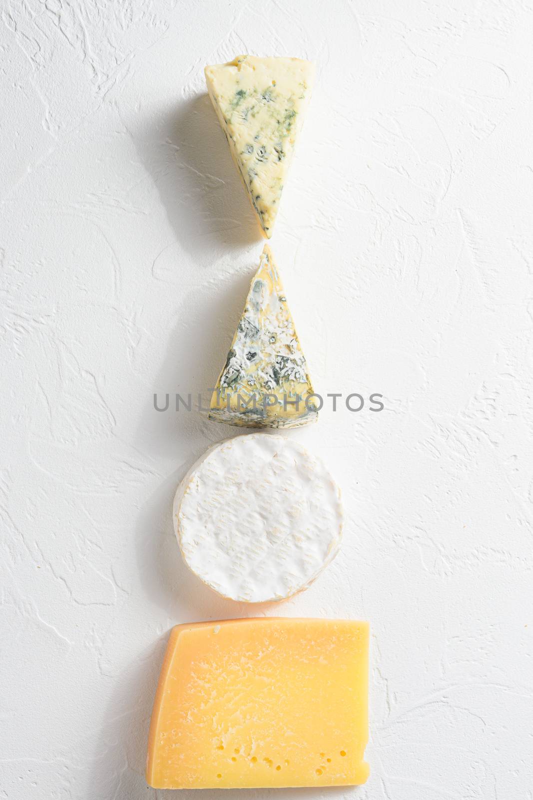 Set cheeses. parmesan , blue cheese, , brie cheese. Top view. On a white background. Free copy space