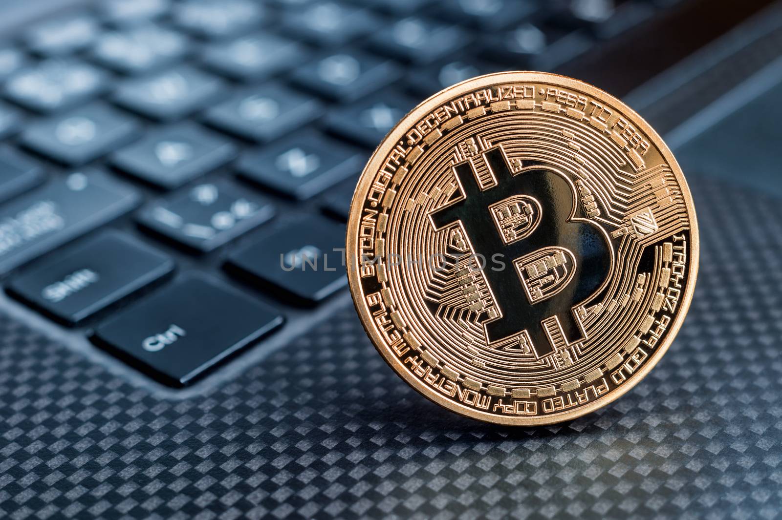 Bitcoin cryptocurrency golden coin on a keyboard