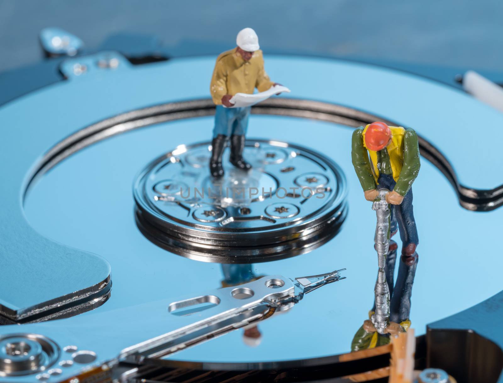 Small mining figurine illustrating concept of artificial intelligence or machine learning using deep data analytics