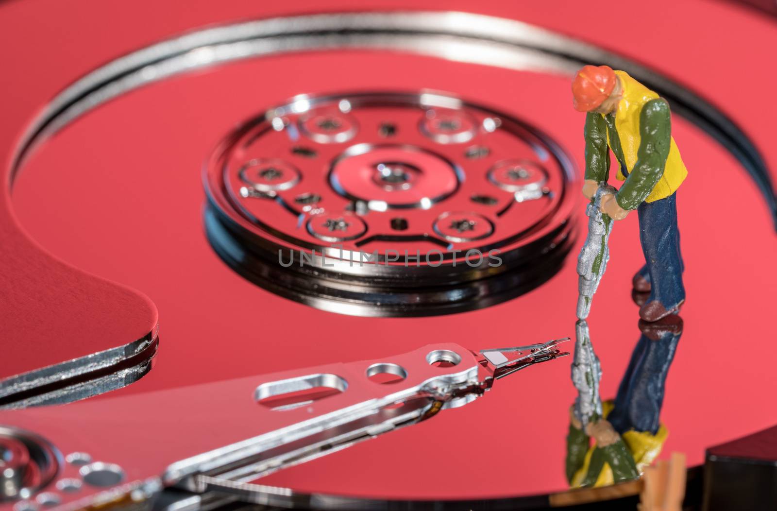 Small mining figurine illustrating concept of artificial intelligence or machine learning using deep data analytics