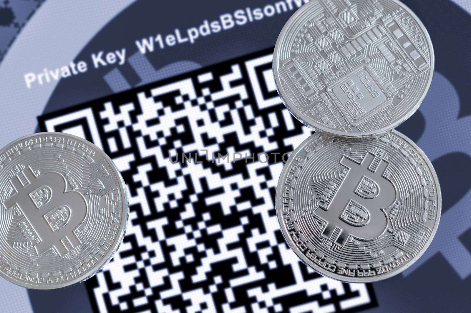 Cryptocurrency Bitcoin metallic coins, QR code and paper wallet. by mbruxelle