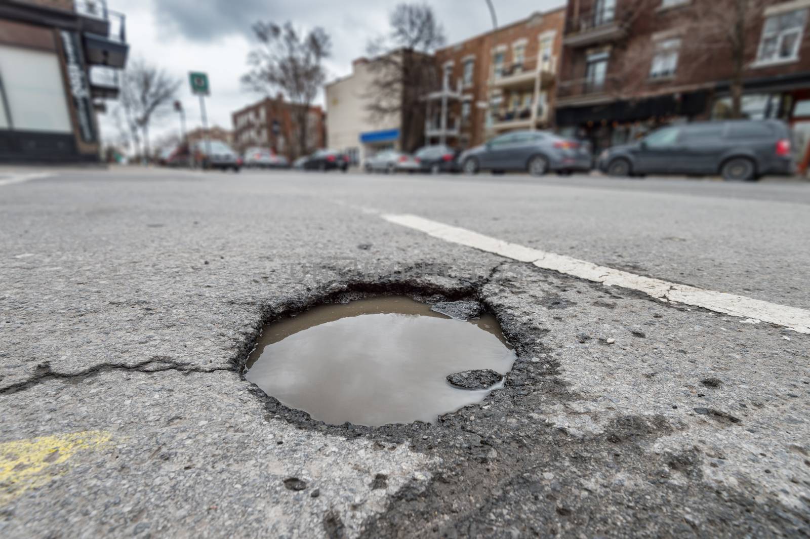 Large pothole on Papineau Avenue in Montreal, Canada (2018)