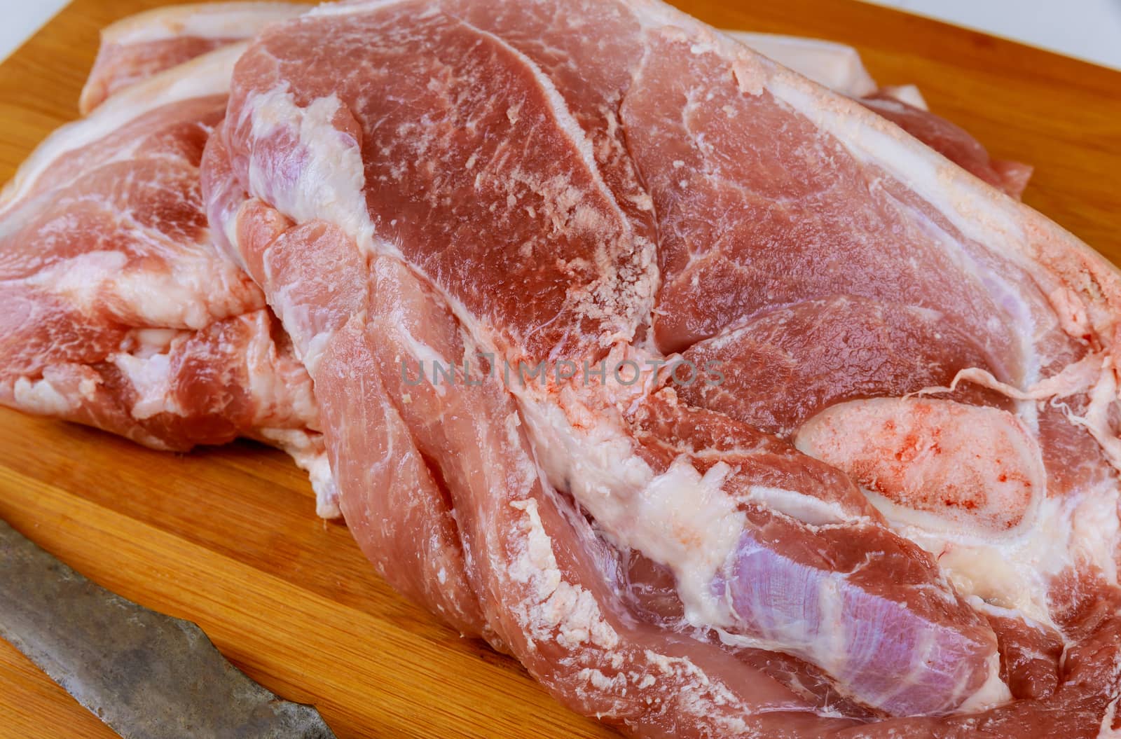 Raw pork meat steak prepared for cooking by ungvar