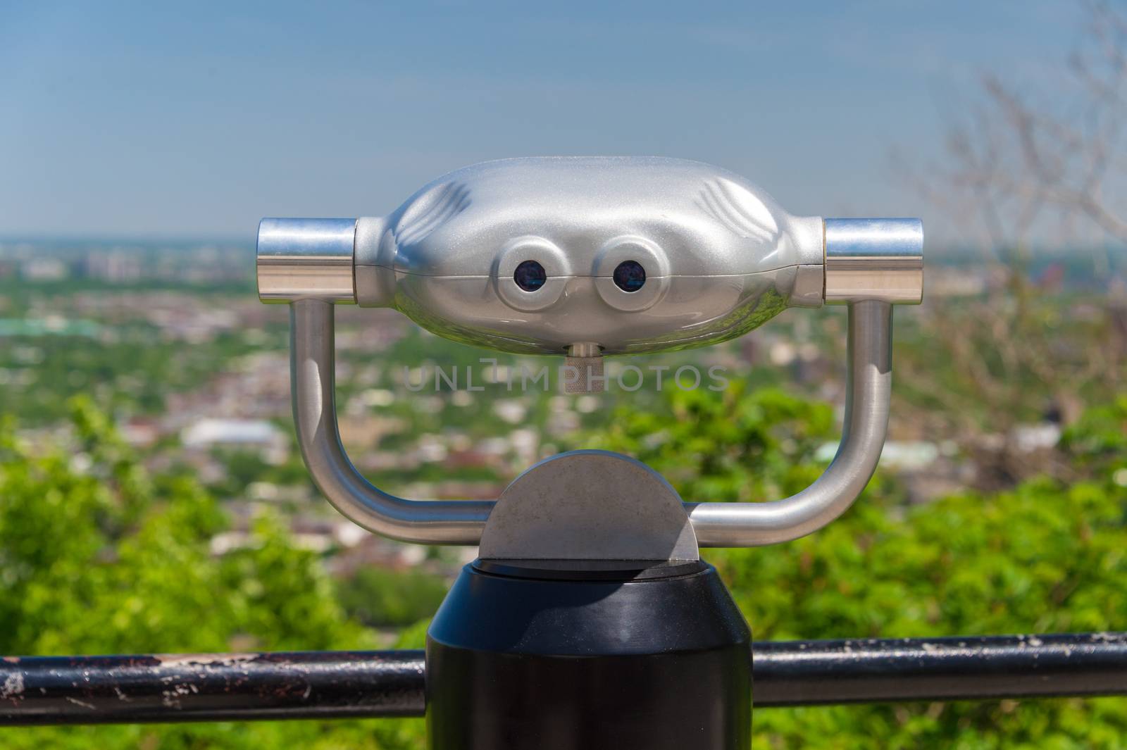 Public binoculars and Montreal skyline, Canada by mbruxelle