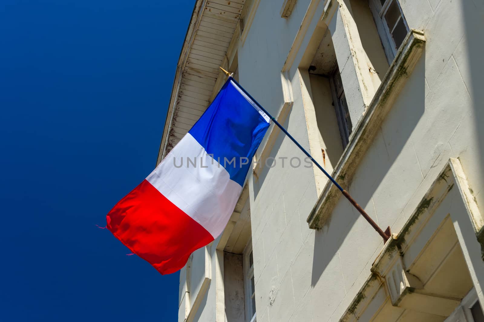 French flag flying outside a house in France