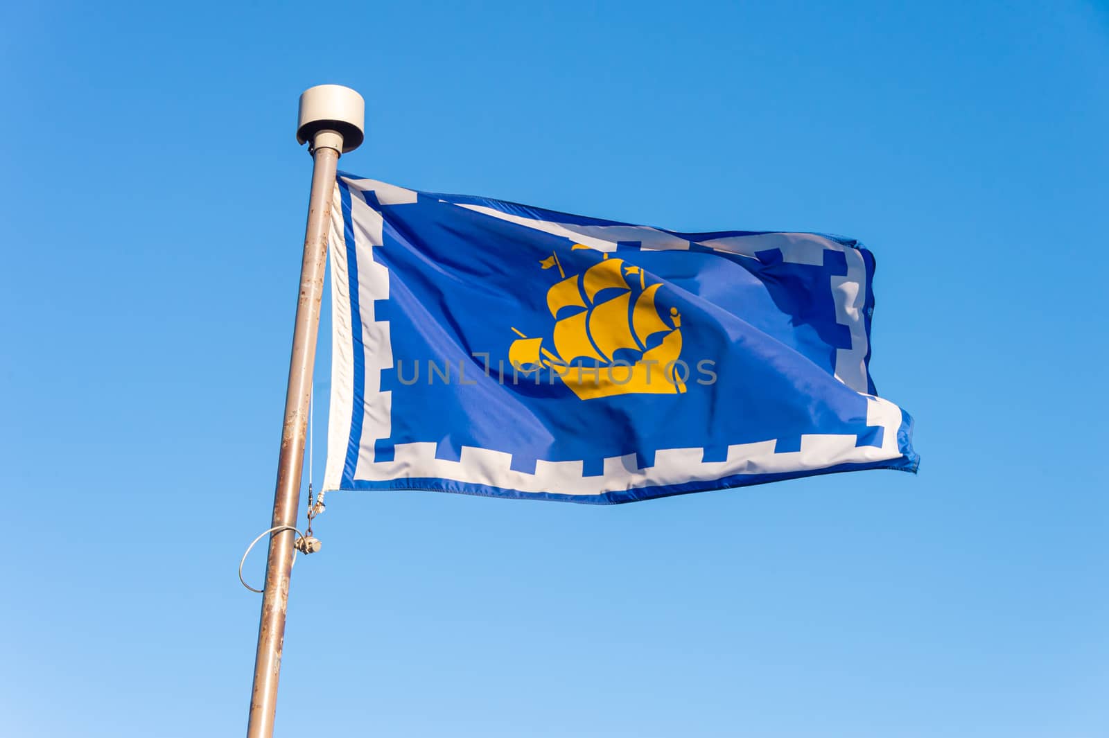 Quebec city flag over blue sky in Quebec City