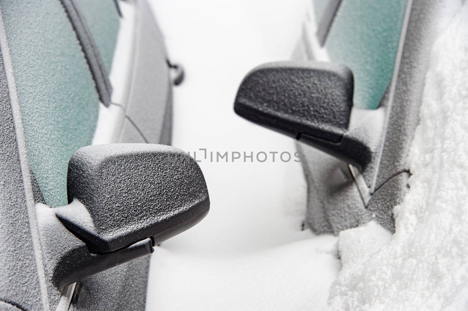 Car mirrors of two cars buried in the snow after snowstorm (Montreal, Canada)