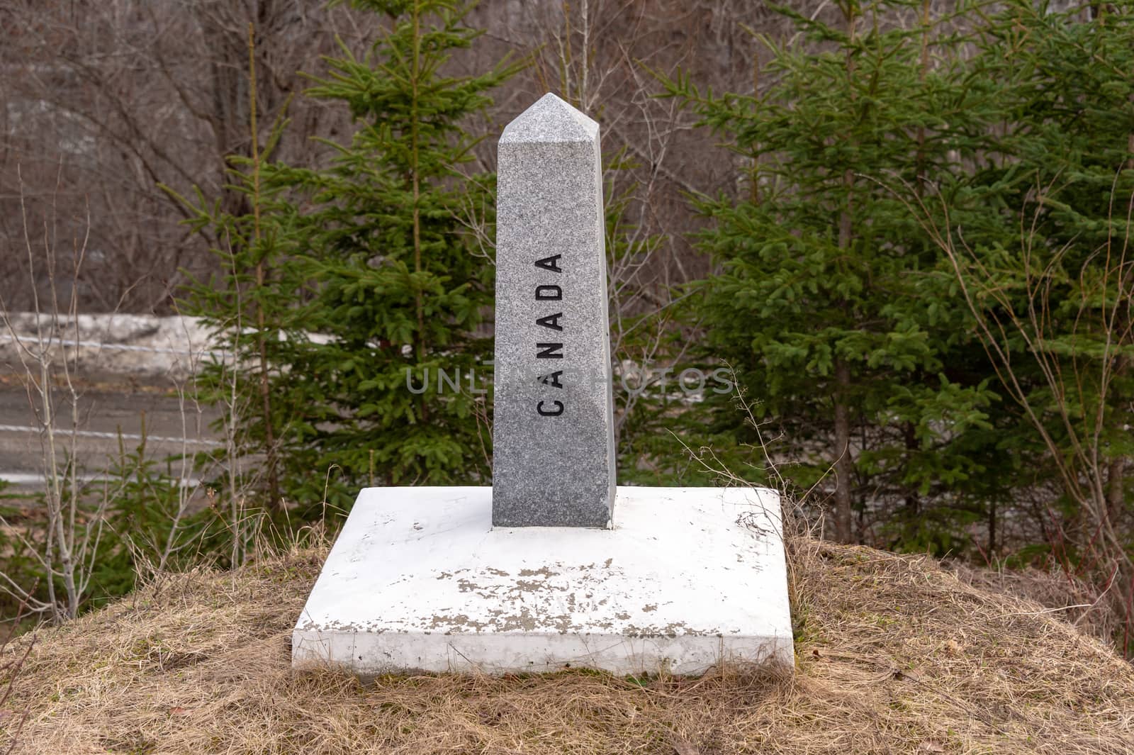 A boundary stone marks the US/Canada border in Quebec, near Coaticook.