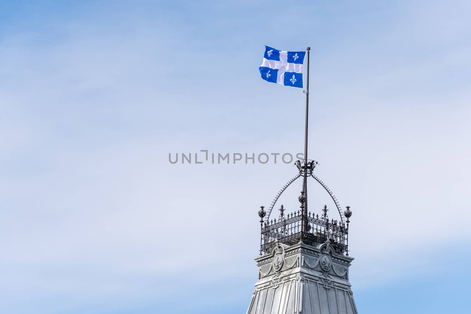 Quebec Flag at the top of the Quebec Parliament building in Quebec City.