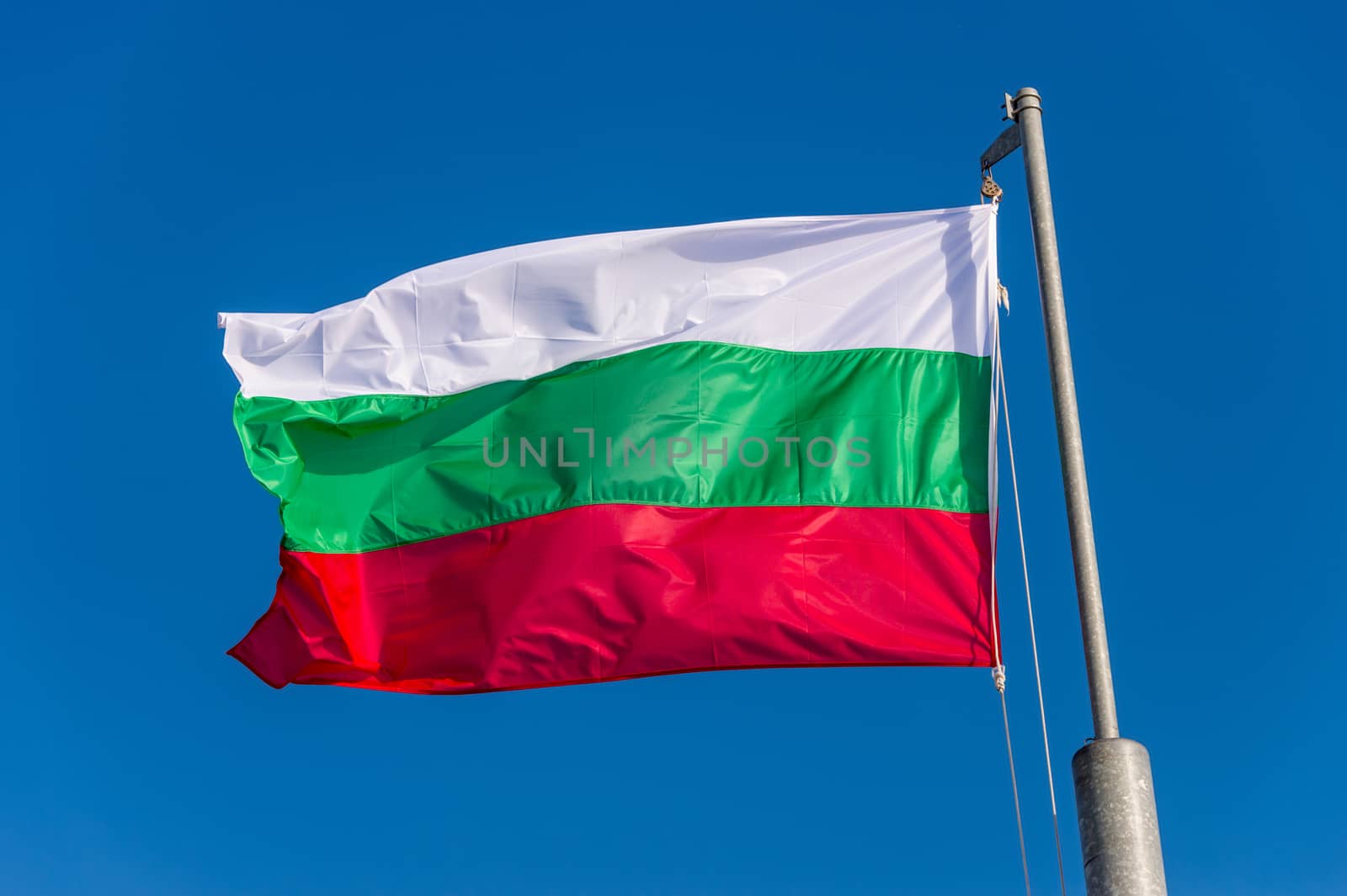 Bulgarian flag waving against blue sky in Boulogne sur Mer, Fran by mbruxelle
