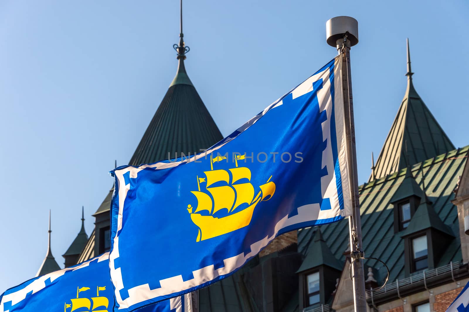 Quebec city flags in front of Chateau Frontenac in Quebec City
