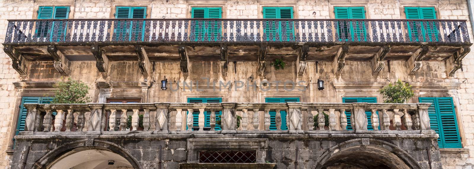 Green shutters on house in streets of old town Kotor in Montenegro