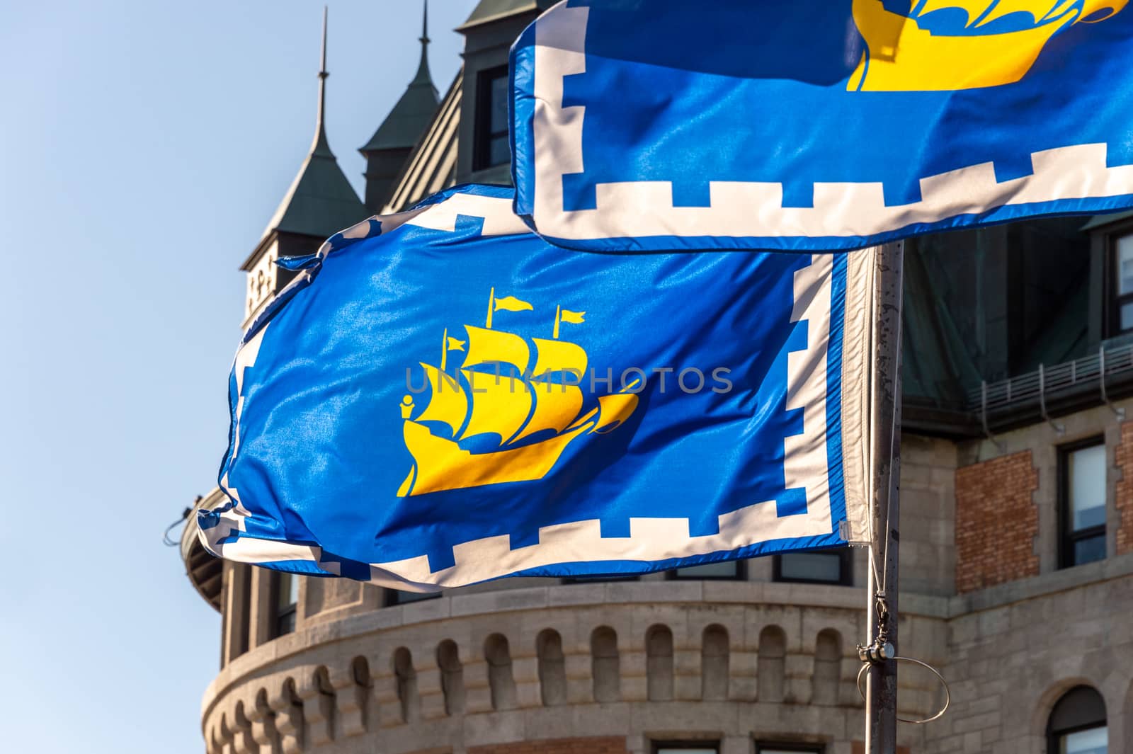 Quebec city flags in front of Chateau Frontenac in Quebec City