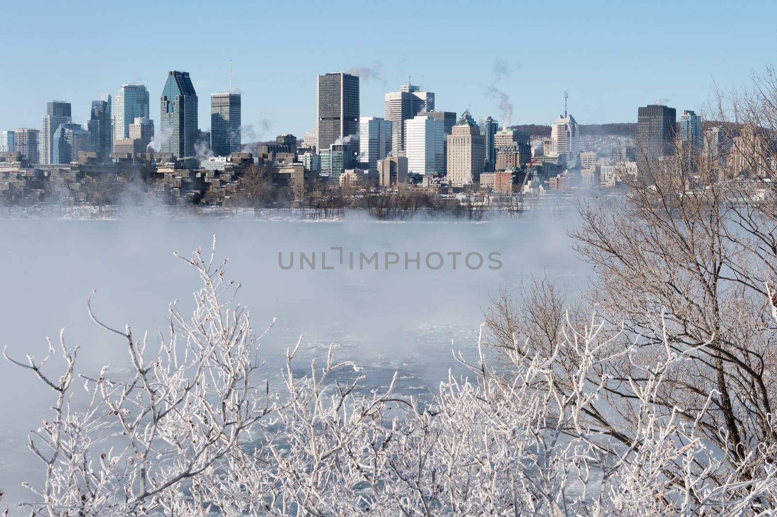 Montreal, CA - 1 January 2018: Montreal Skyline in winter as ice fog rises off the St. Lawrence River