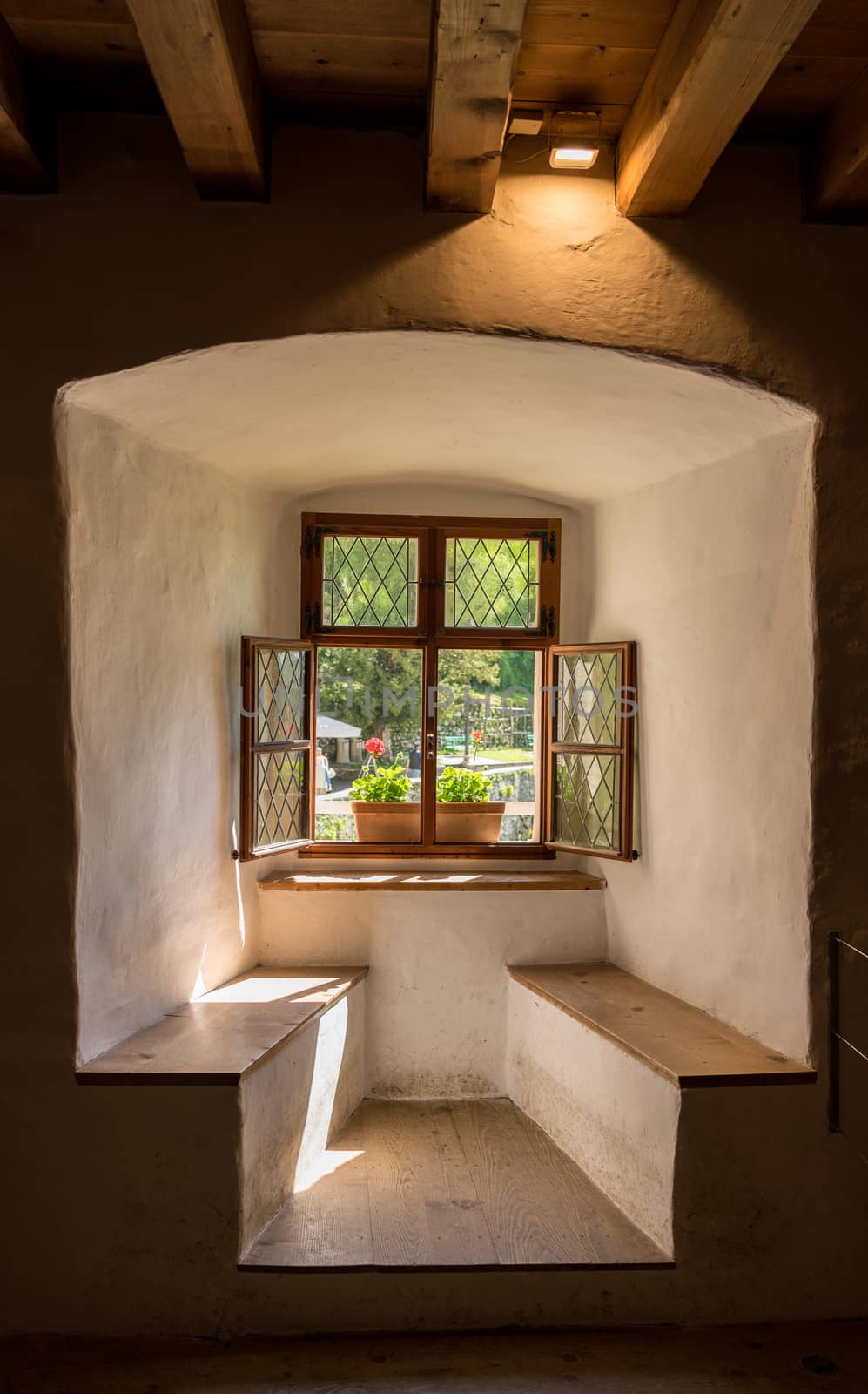 Window and seat in old castle in Slovenia by steheap