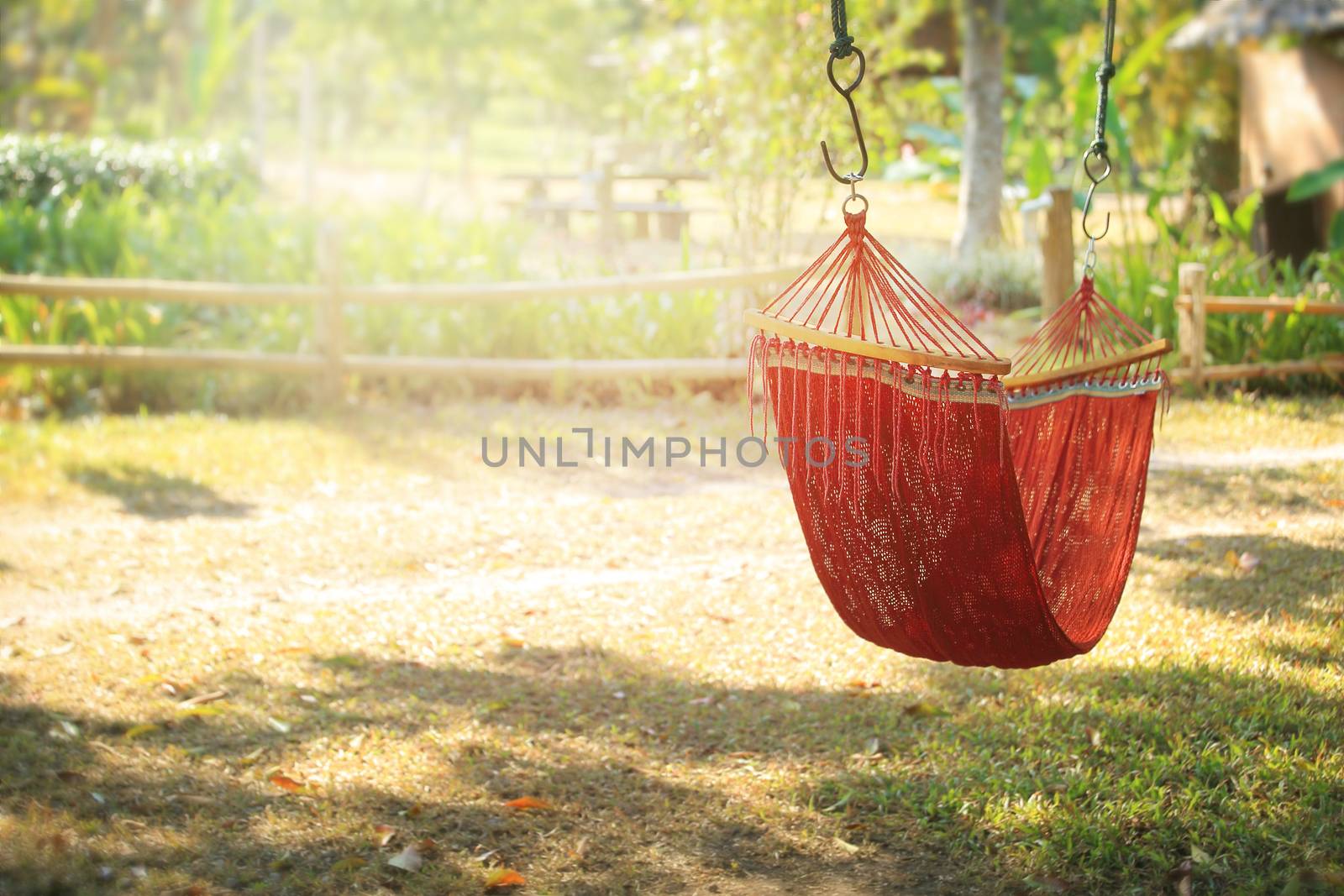 Lazy time with hammock in the summer garden, vintage toned.