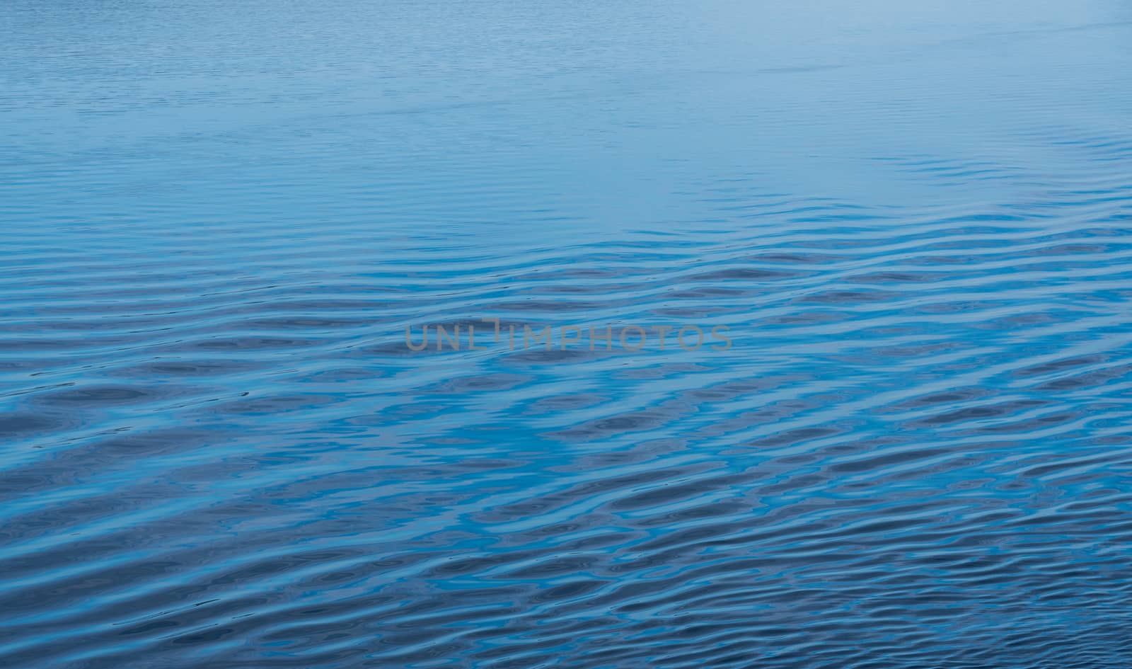 Ripples in the calm Adriatic sea off the coast of Croatia as ship approaches port of Zadar