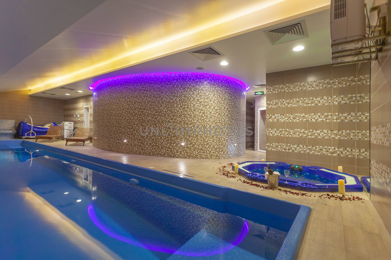 Attractive Indoor Pool and Tub in Modern Luxuty Spa Center