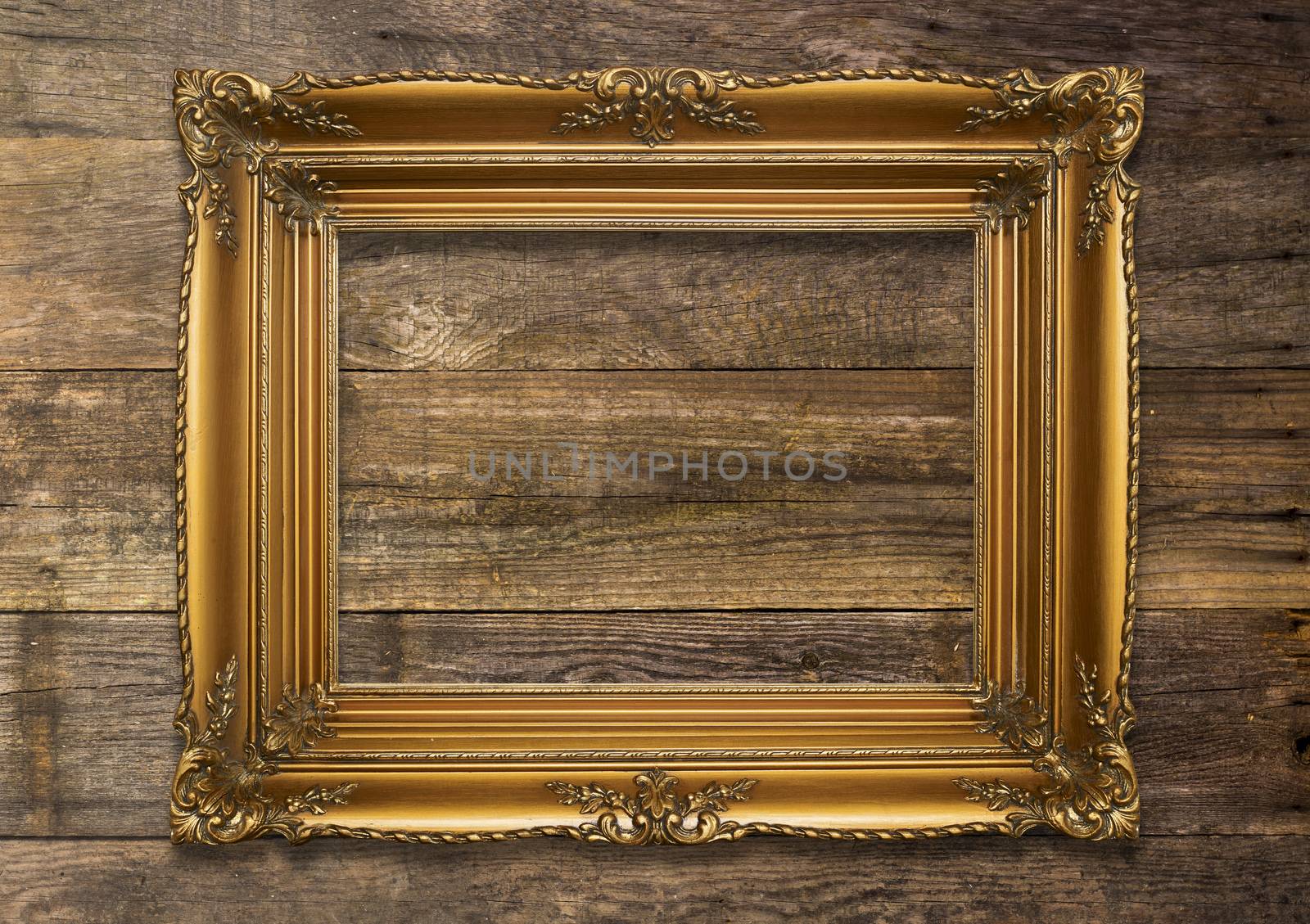 Old Brown Picture Frame on wooden background by adamr